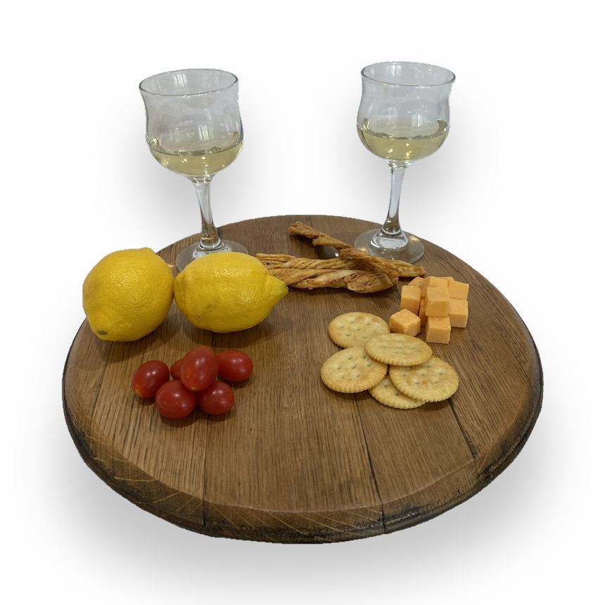 The Lazy Susan Round Swivel Wooden Tray, hand made from solid wood barrel heads, stylishly serves wine glasses, snacks, and more—ideal as a food-safe tray or centerpiece for gatherings.