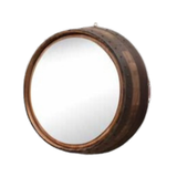 The Round Mirror showcases a rustic, round design with a frame of dark wood that evokes the look of reclaimed whiskey barrels.