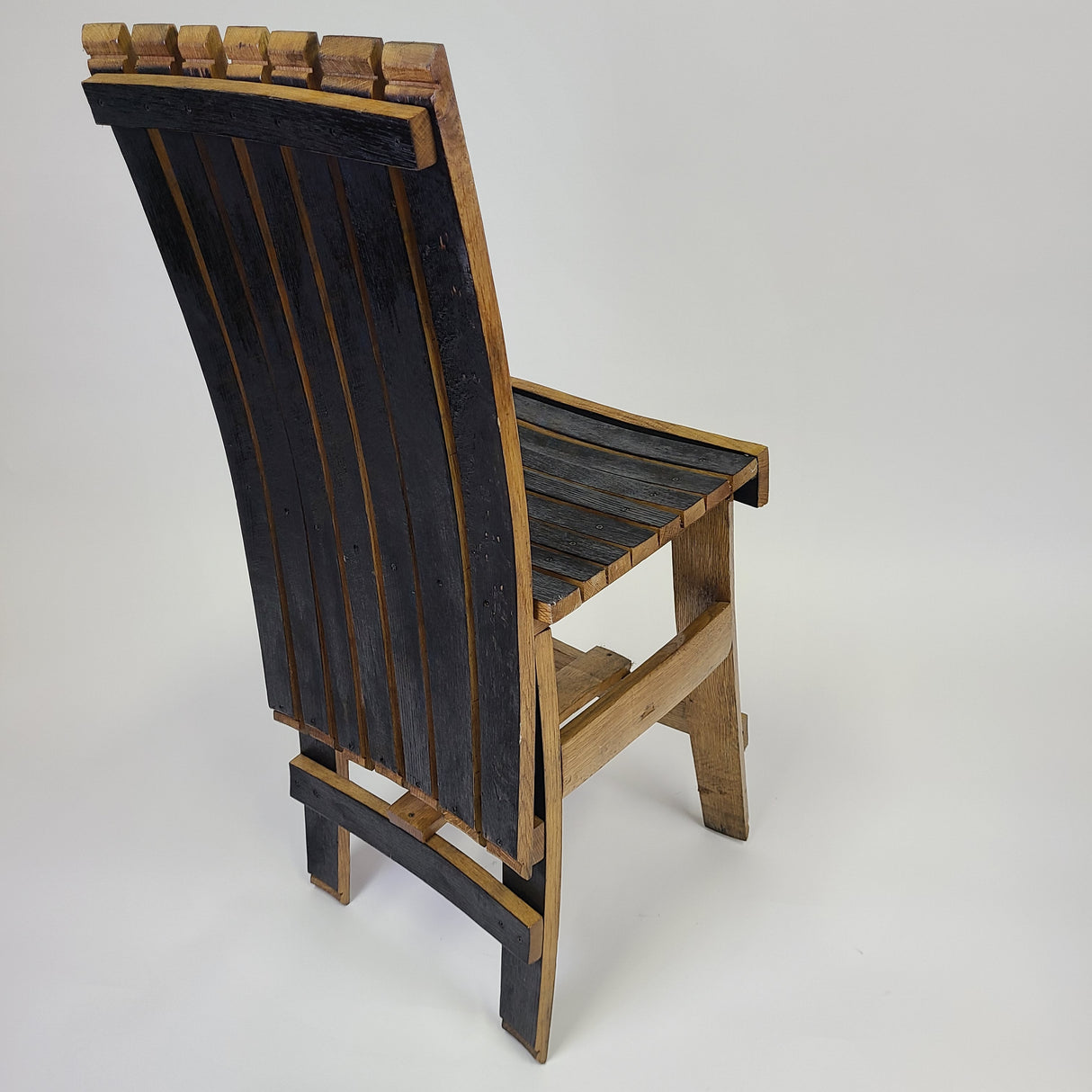 Quality craftsmanship shines through in the Stave Chair without Arm Rest - S003, featuring a slatted backrest and seat. The sleek design elegantly combines light and dark wood tones against a white background, all for $200.00.