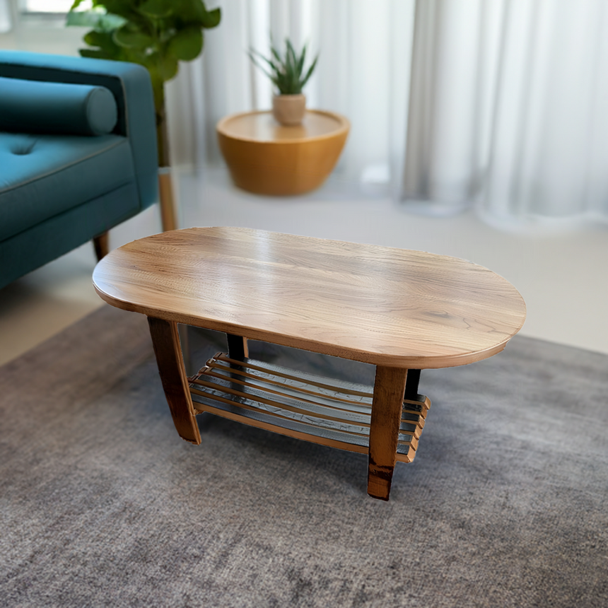The Whiskey Barrel Stave Oval Coffee Table With Stave Shelf, featuring a rustic design and lower stave shelf, sits on a gray rug in a bright living room.