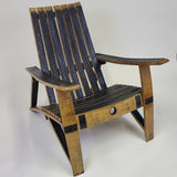 The Whiskey Barrel Stave Adirondack Chair S006, priced at $300.00, is a beautifully crafted wooden chair made from whiskey barrel staves. It features a slatted back and seat with armrests and is showcased against a white background, making it an excellent choice for outdoor furniture enthusiasts.