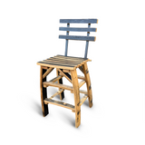 A barstool chair with a backrest, handmade from solid wood barrel staves, features a slatted design using rustic, mismatched planks reminiscent of reclaimed bourbon barrels.