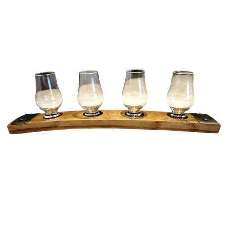 Four whiskey glasses rest empty and evenly spaced on the Whiskey Tasting Flight Board for 4 Glasses, crafted from hand-made solid wood.