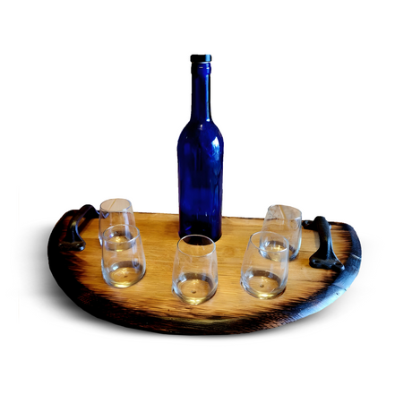 The Wine Tasting Tray, featuring a round wooden design with handles, holds a blue bottle and five empty glasses, showcasing handcrafted rustic elegance perfect for any gathering.