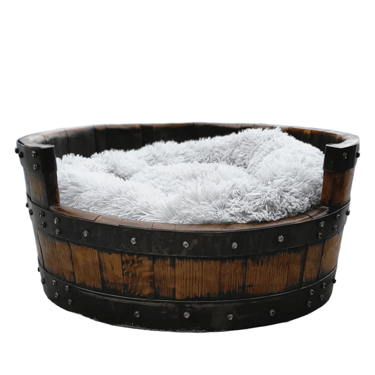 The Dog Bed Wooden features a round frame and handmade solid wood barrel construction, complete with a soft, plush pillow inside to offer your furry friend the ultimate relaxation experience.