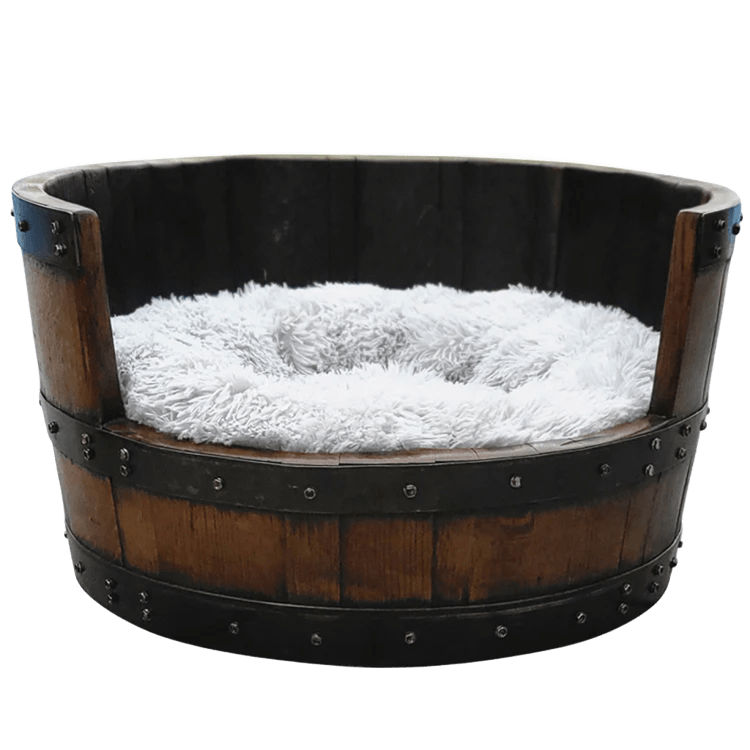 Round frame dog bed handcrafted from solid wood barrels, featuring a plush white cushion for maximum pet comfort.