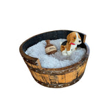 A plush dog toy rests in the premium Dog Bed Wooden, featuring a handmade solid wood barrel construction and a fluffy cushion.